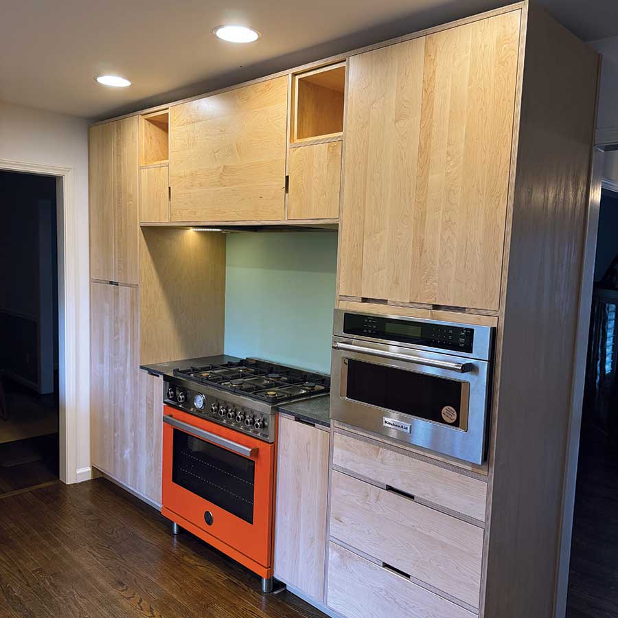 Mid-century stove and kitchen cabinets designed by Gray Gatlin Deisgn