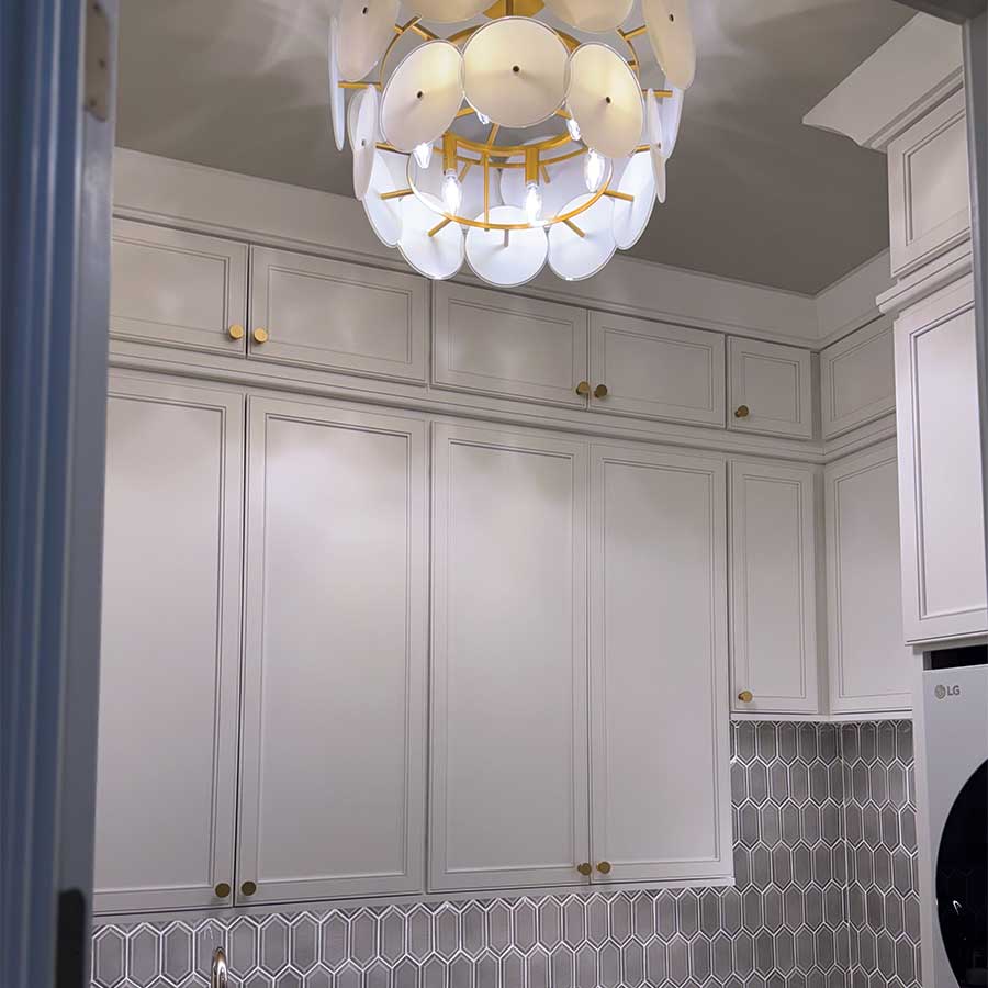 laundry cabinets and chandelier designed by Gray Gatlin Deisgn
