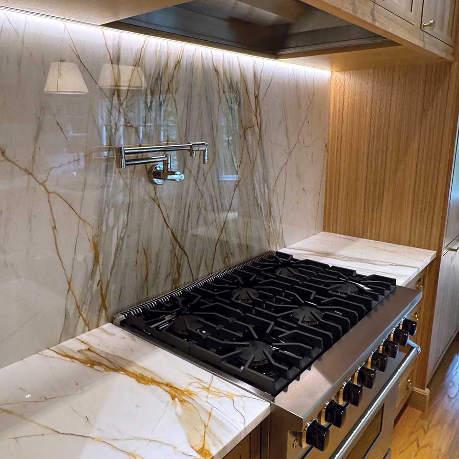 closeup of stove and cabinets designed by Gray Gatlin Deisgn